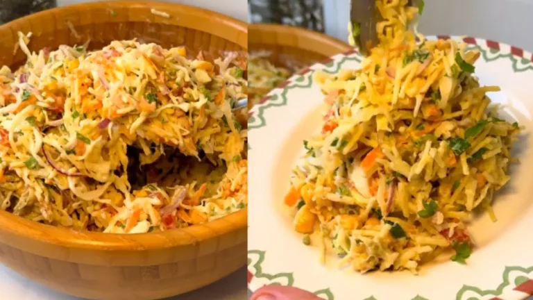 Salada cremosa de repolho com cenoura, cebola roxa, milho e batata palha servida em tigela branca.